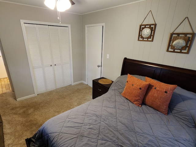 carpeted bedroom featuring a closet and crown molding