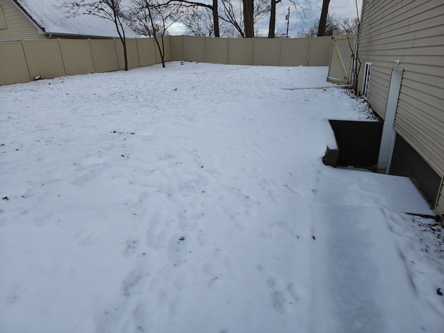 view of yard layered in snow