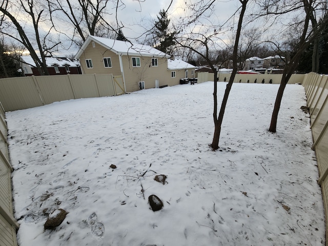 view of yard layered in snow