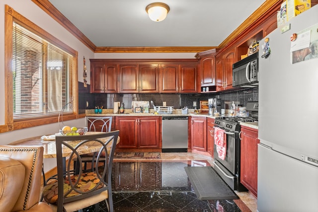 kitchen featuring backsplash, sink, stainless steel appliances, and ornamental molding