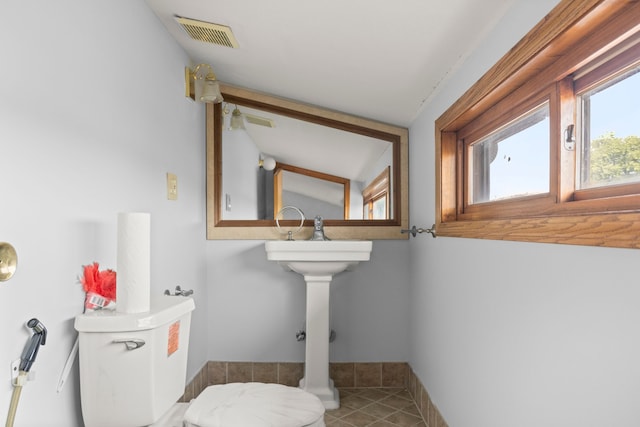 bathroom with tile patterned floors, toilet, and sink