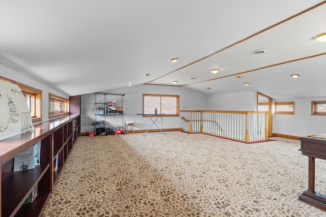 interior space featuring vaulted ceiling and a wealth of natural light