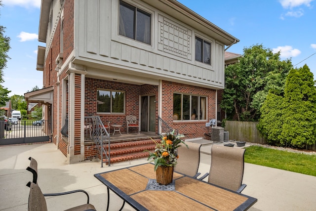 back of property with a patio