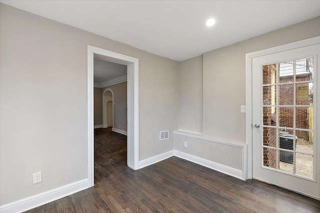 unfurnished room with dark hardwood / wood-style floors and ornamental molding