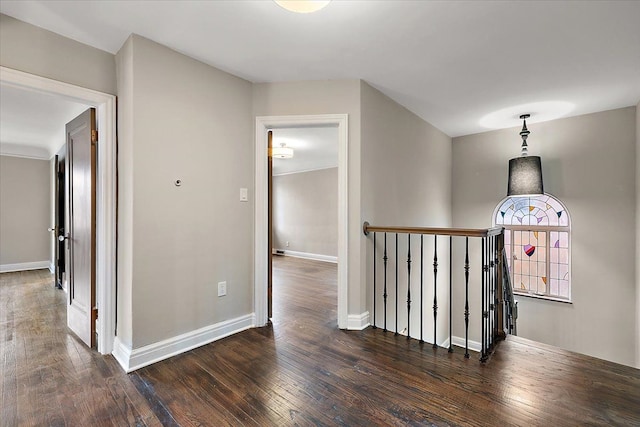 corridor featuring dark hardwood / wood-style flooring