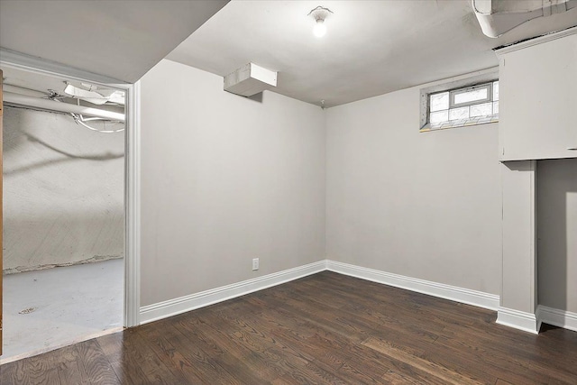 basement with dark wood-type flooring