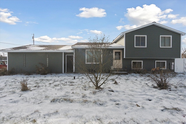 view of snow covered house