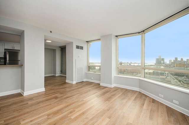 unfurnished living room featuring light hardwood / wood-style floors