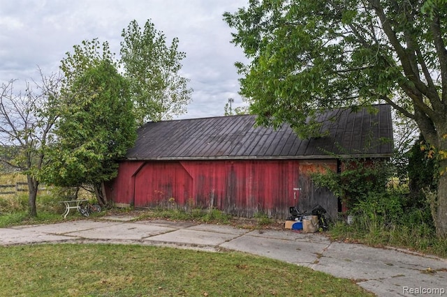 view of outdoor structure with a lawn