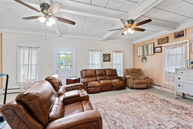 living room with wood walls, beamed ceiling, a baseboard radiator, and ornamental molding