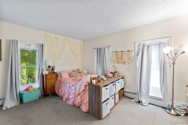 bedroom with a baseboard heating unit