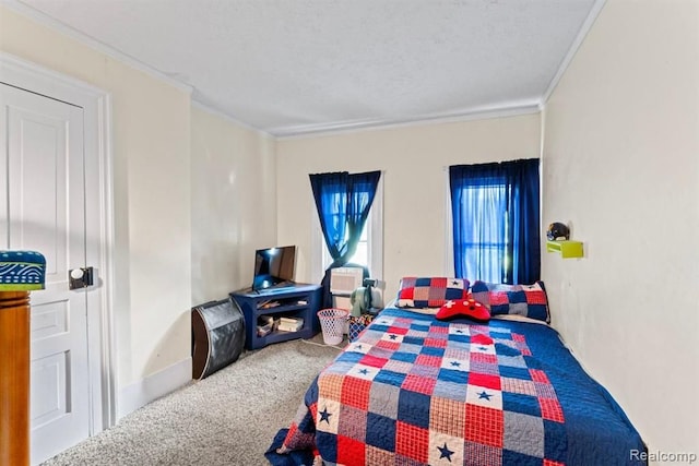 bedroom with crown molding and carpet floors