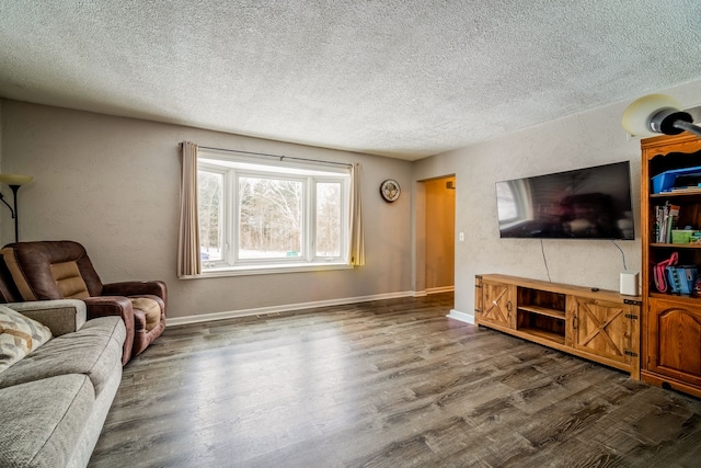 living room with a textured ceiling and dark wood-type flooring