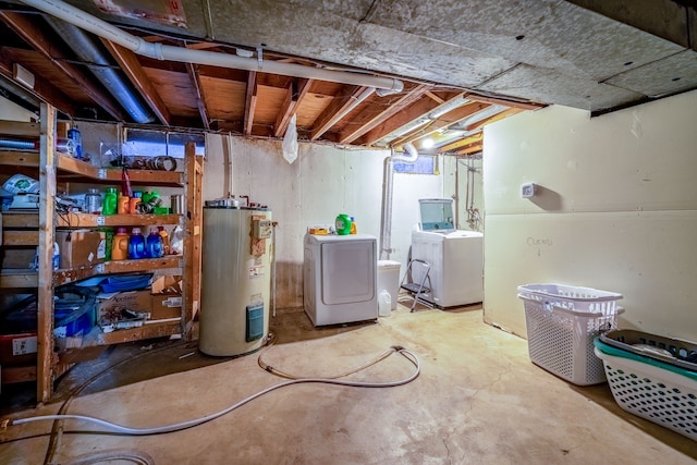 basement featuring electric water heater and washing machine and dryer