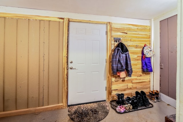 interior space featuring wood walls