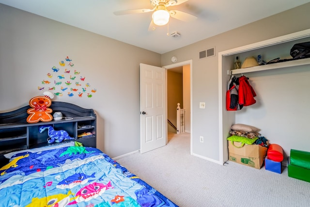 carpeted bedroom with a closet and ceiling fan