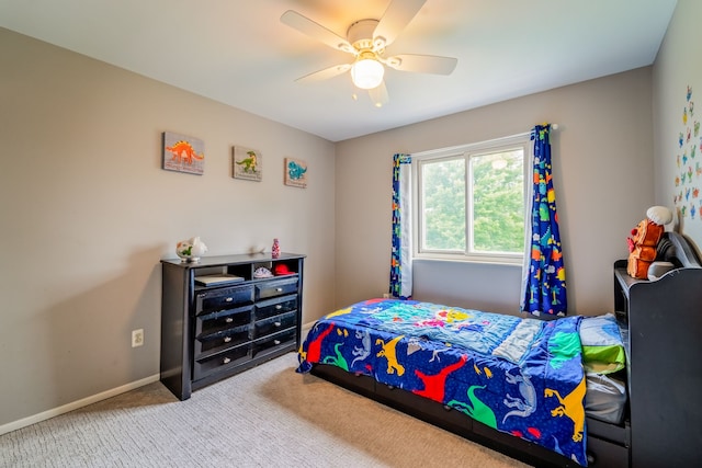 bedroom with ceiling fan and light carpet