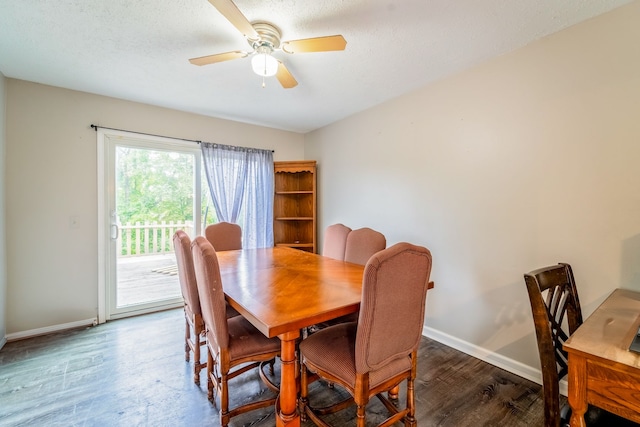 dining space featuring ceiling fan, dark hardwood / wood-style floors, and a textured ceiling