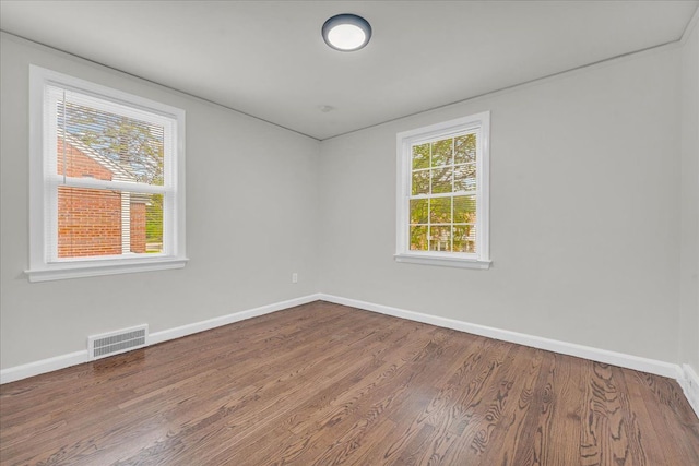 spare room featuring hardwood / wood-style flooring