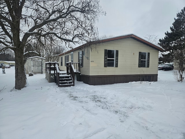 exterior space with a shed and a deck