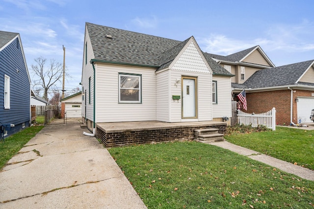 view of front of home with a garage and a front lawn