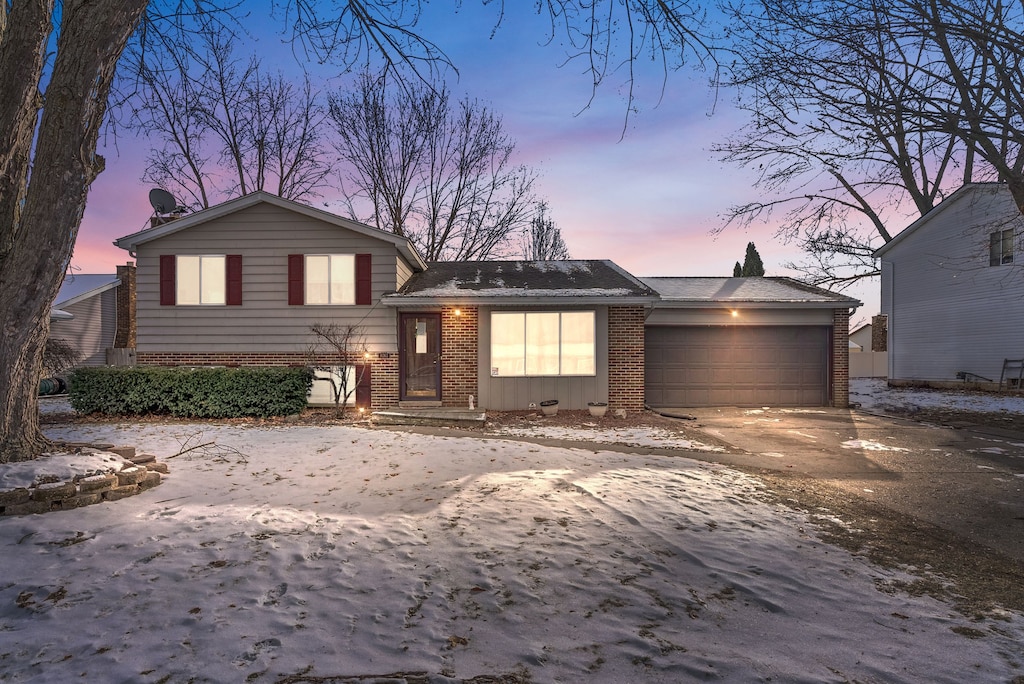 split level home featuring a garage