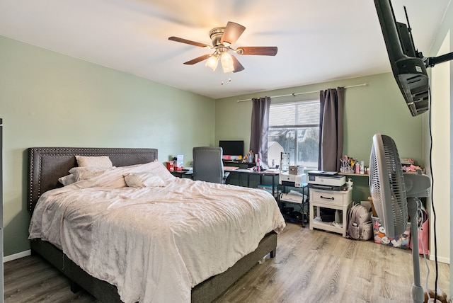 bedroom with ceiling fan and light hardwood / wood-style floors