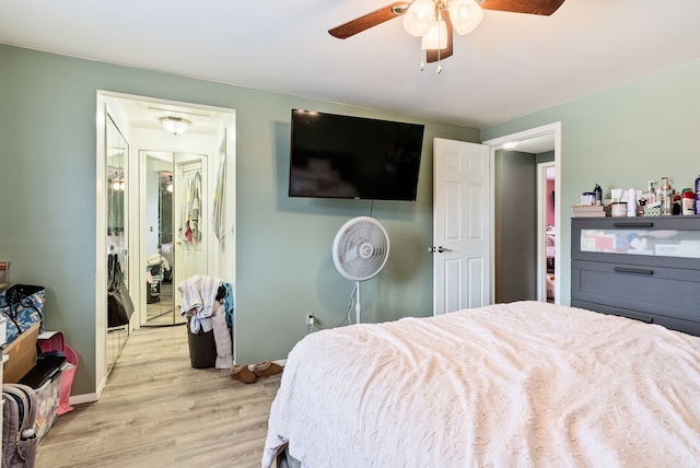 bedroom with ceiling fan and light hardwood / wood-style floors