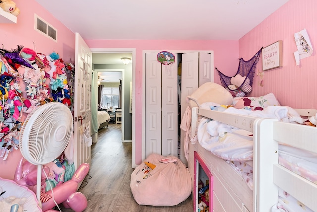 bedroom with hardwood / wood-style flooring