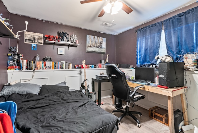 bedroom with hardwood / wood-style floors and ceiling fan