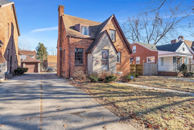 view of front of property with an outdoor structure and a garage