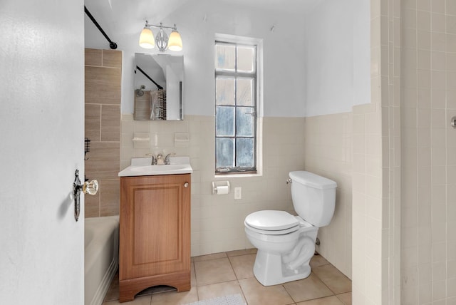 full bathroom featuring tile patterned floors, vanity, toilet, and plenty of natural light