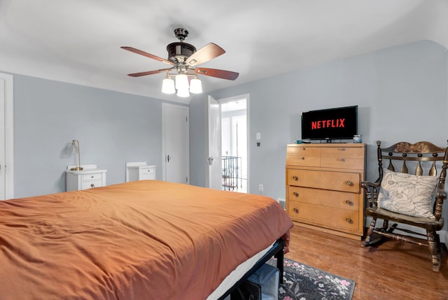 bedroom with ceiling fan and wood-type flooring