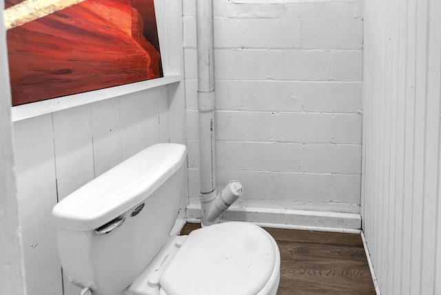 bathroom featuring hardwood / wood-style floors and toilet