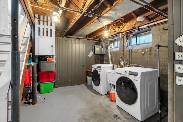 laundry area featuring washer and clothes dryer and electric panel