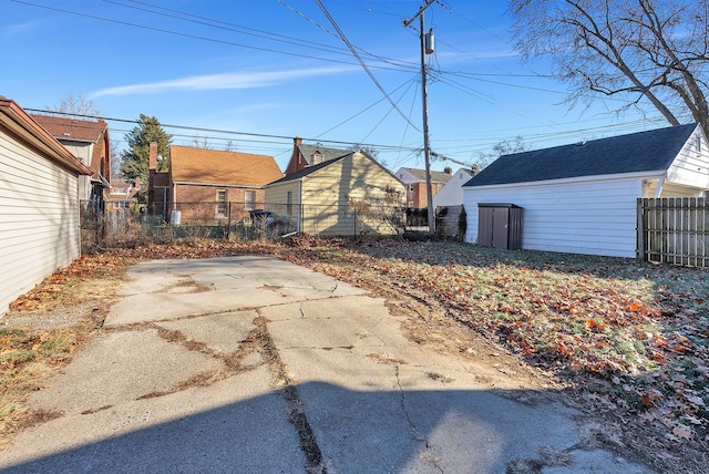 view of yard with an outbuilding and a patio