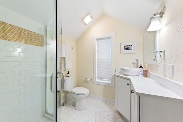 bathroom with vanity, lofted ceiling, tile patterned floors, toilet, and walk in shower