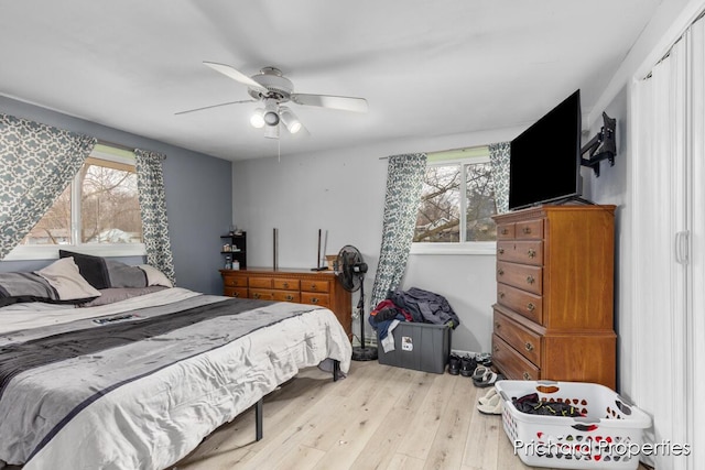 bedroom featuring ceiling fan and light hardwood / wood-style floors