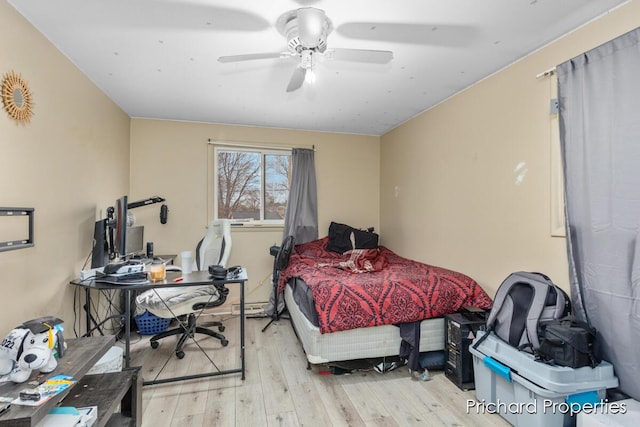 bedroom with ceiling fan and light hardwood / wood-style flooring