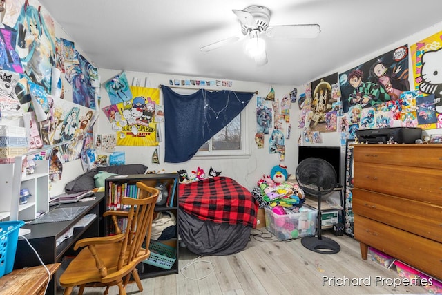 bedroom with wood-type flooring and ceiling fan