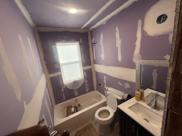 bathroom with a bathtub, vanity, and toilet