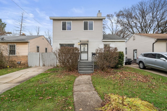 view of property with a front lawn