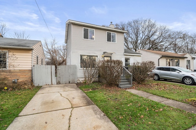 front facade with a front yard