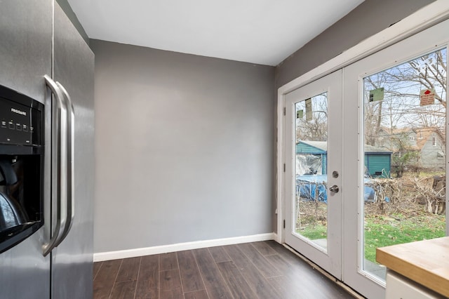 doorway featuring french doors and dark wood-type flooring