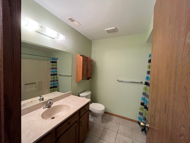 bathroom featuring toilet, a shower with curtain, vanity, and tile patterned floors