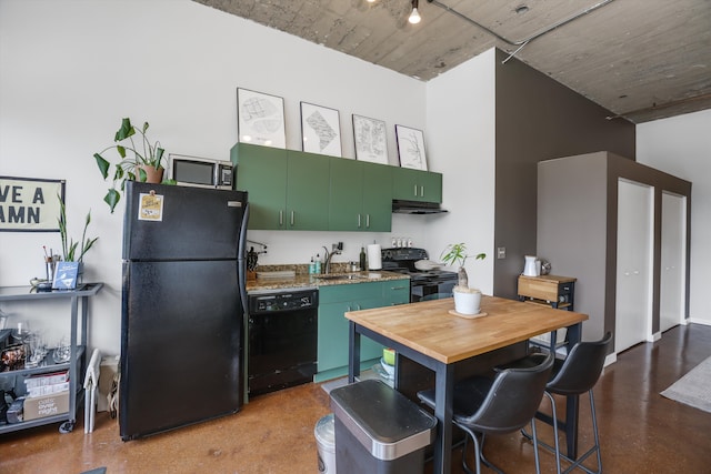 kitchen featuring sink, green cabinetry, and black appliances