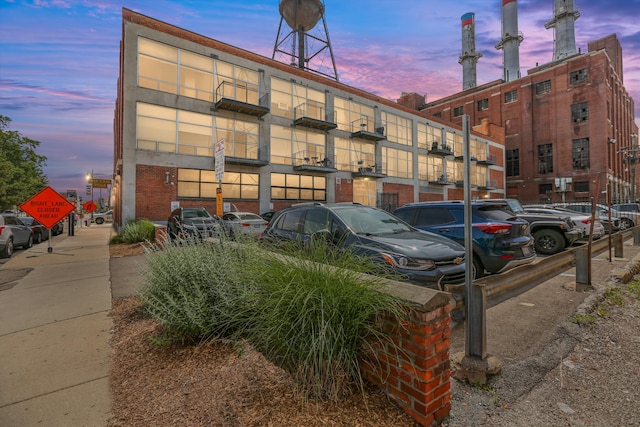 view of outdoor building at dusk