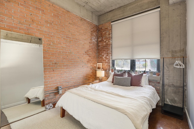 bedroom with brick wall