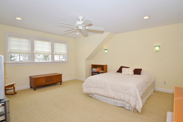 bedroom with recessed lighting, light colored carpet, and baseboards