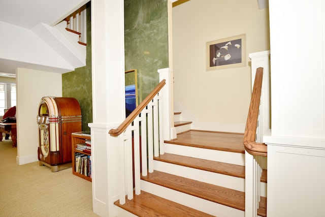 stairs featuring carpet